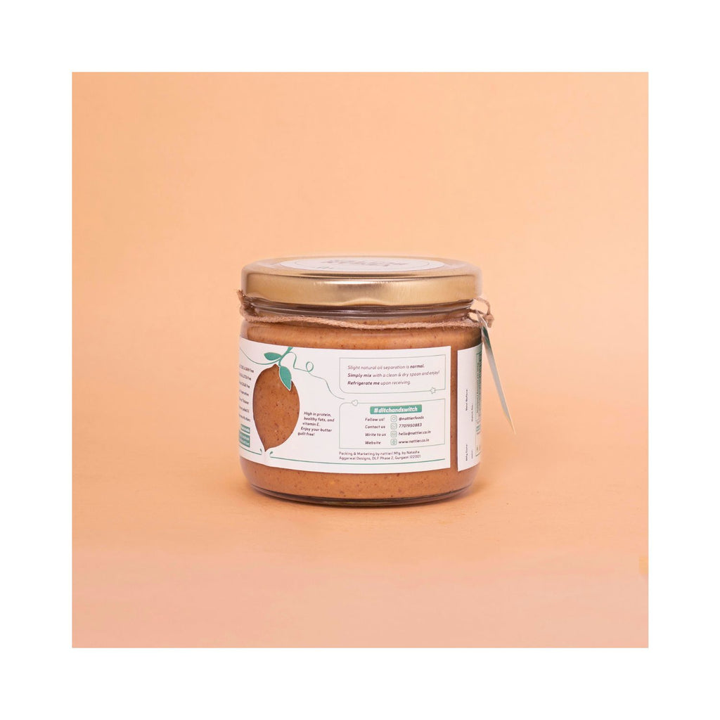Jar of vegan butter with usage label on a peach background