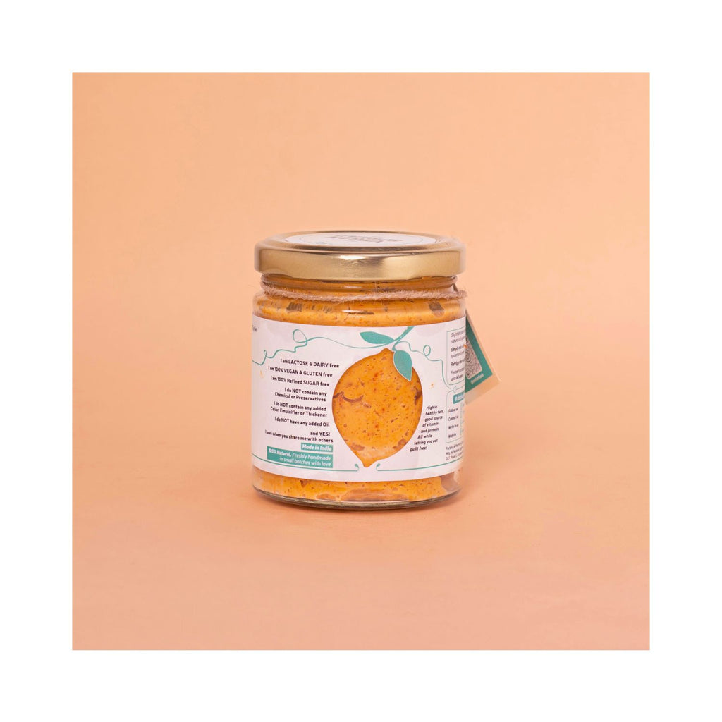 Jar of chilli spread with a white label on a peach background