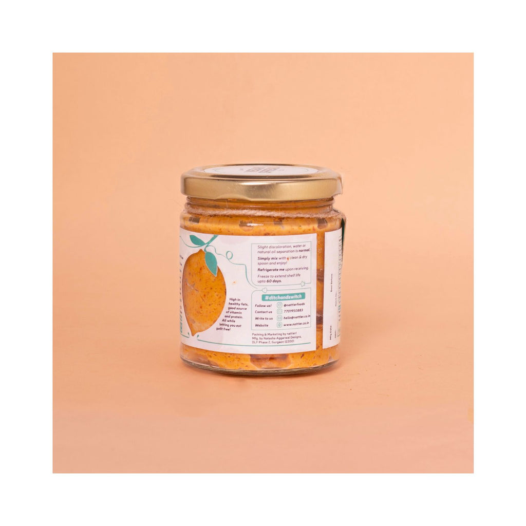 Jar of chilli spread with a label on a peach background