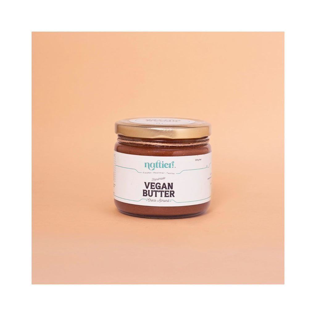 Jar of vegan butter with a label on a peach background