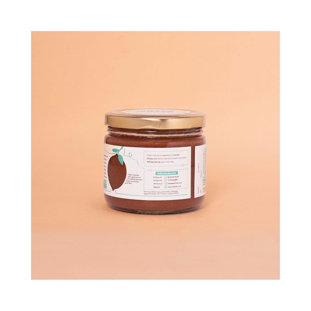 Jar of vegan butter with usage label on a peach background