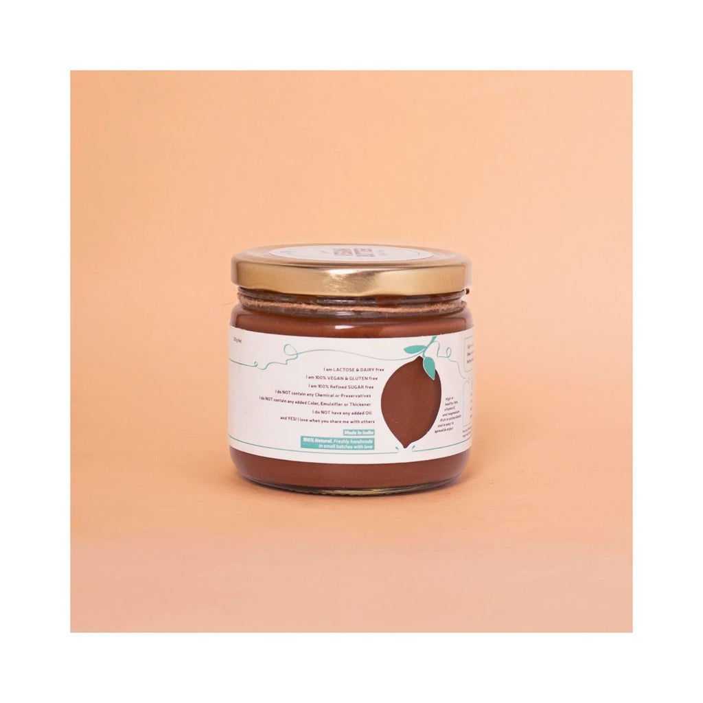 Jar of  vegan butter with a benefits label on a peach background