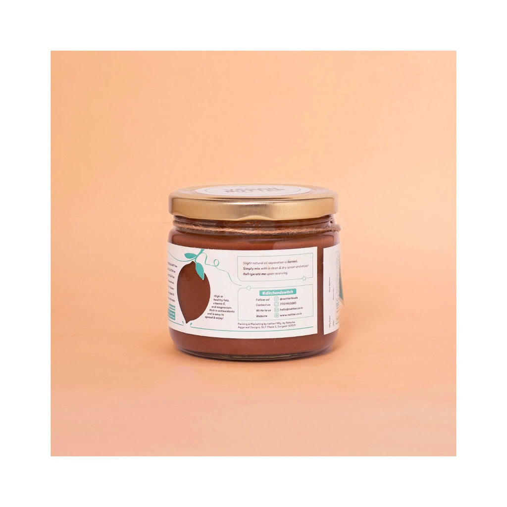 Jar of  vegan butter with a usage label on a peach background