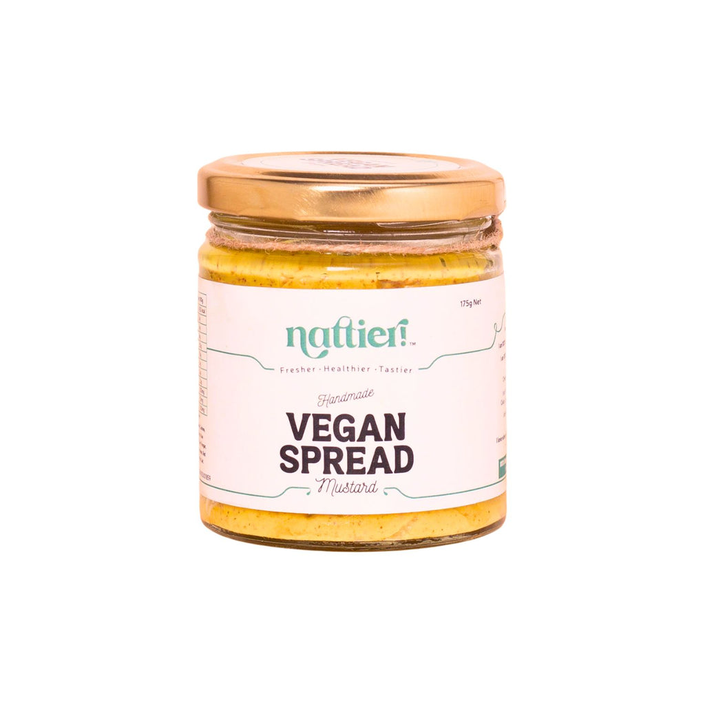 Jar of vegan mustard spread with a visible brand label on a white background
