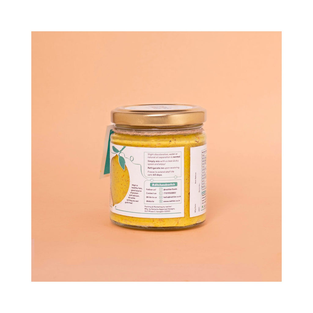 Jar of mustard spread with a usage label on a peach-colored background