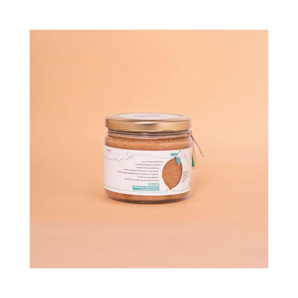 Jar of peanut butter with benefits label on a peach background