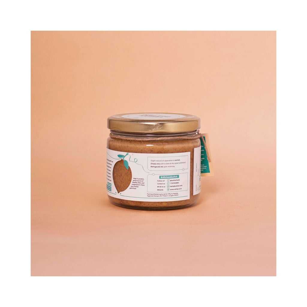 Jar of peanut butter with usage label on a peach background
