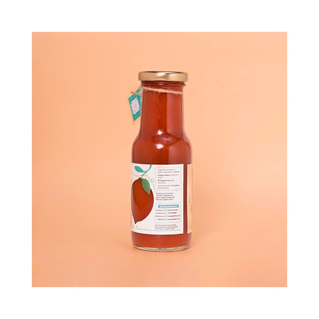 Bottle of hot & sweet ketchup with white usage label on a peach background