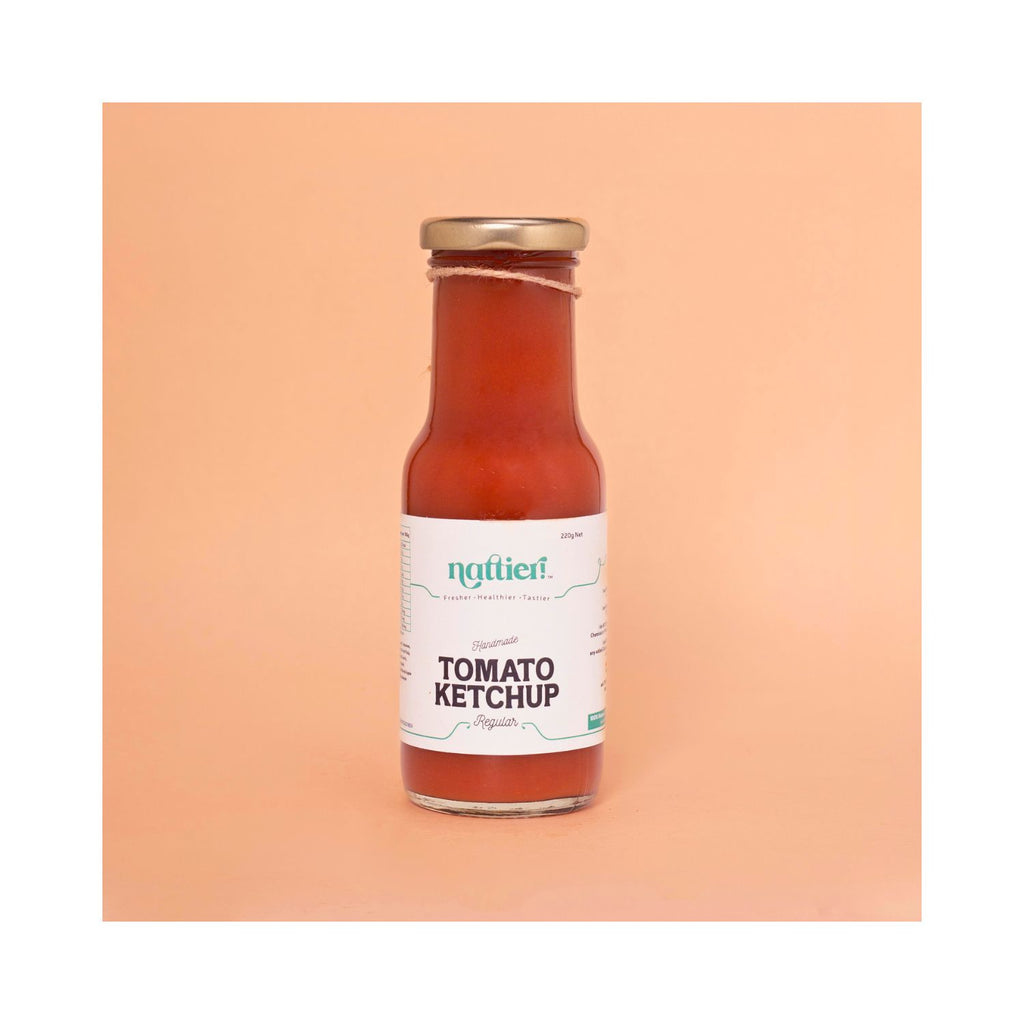 Bottle of Ketchup with white label on peach background