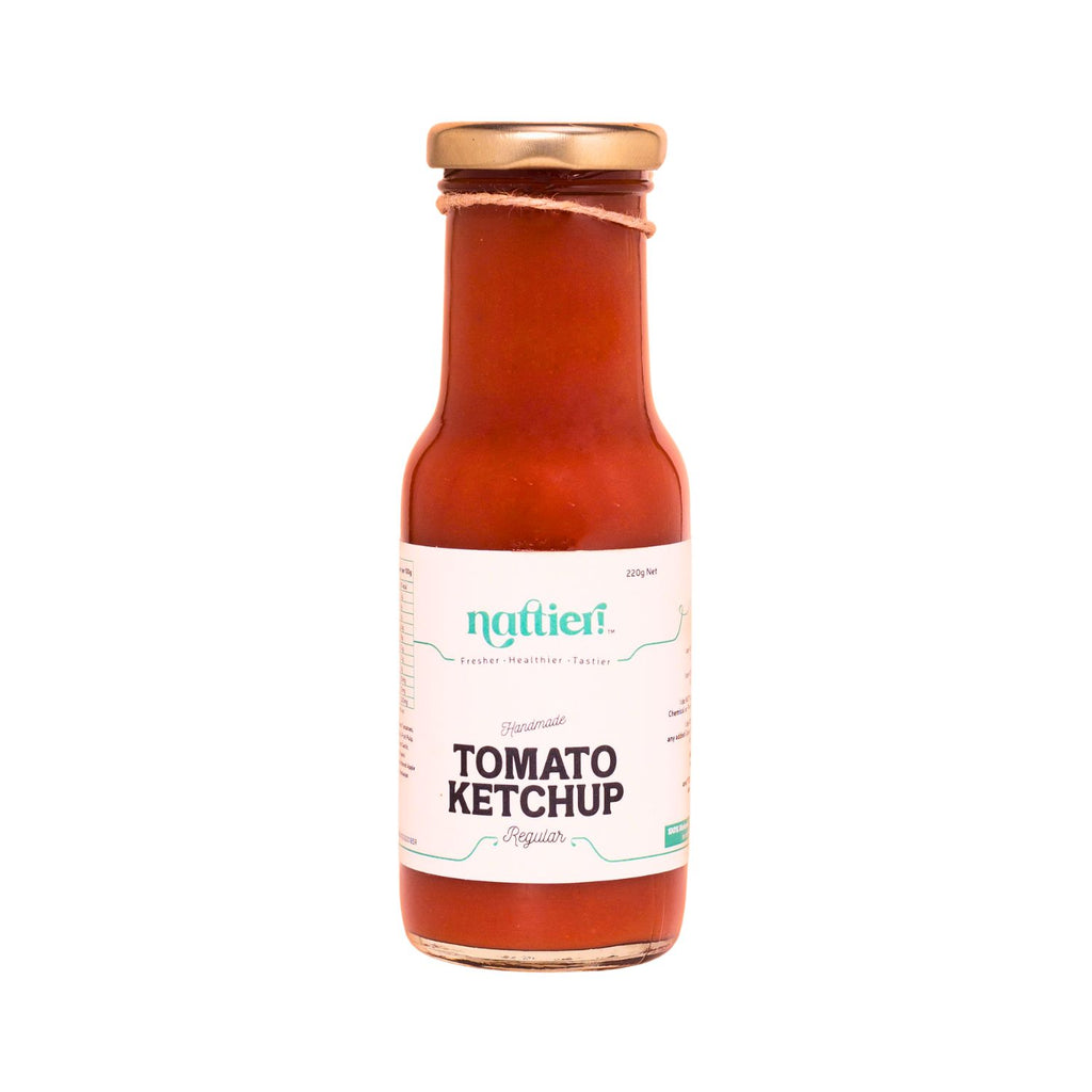 Bottle of tomato ketchup with a white label on a white background