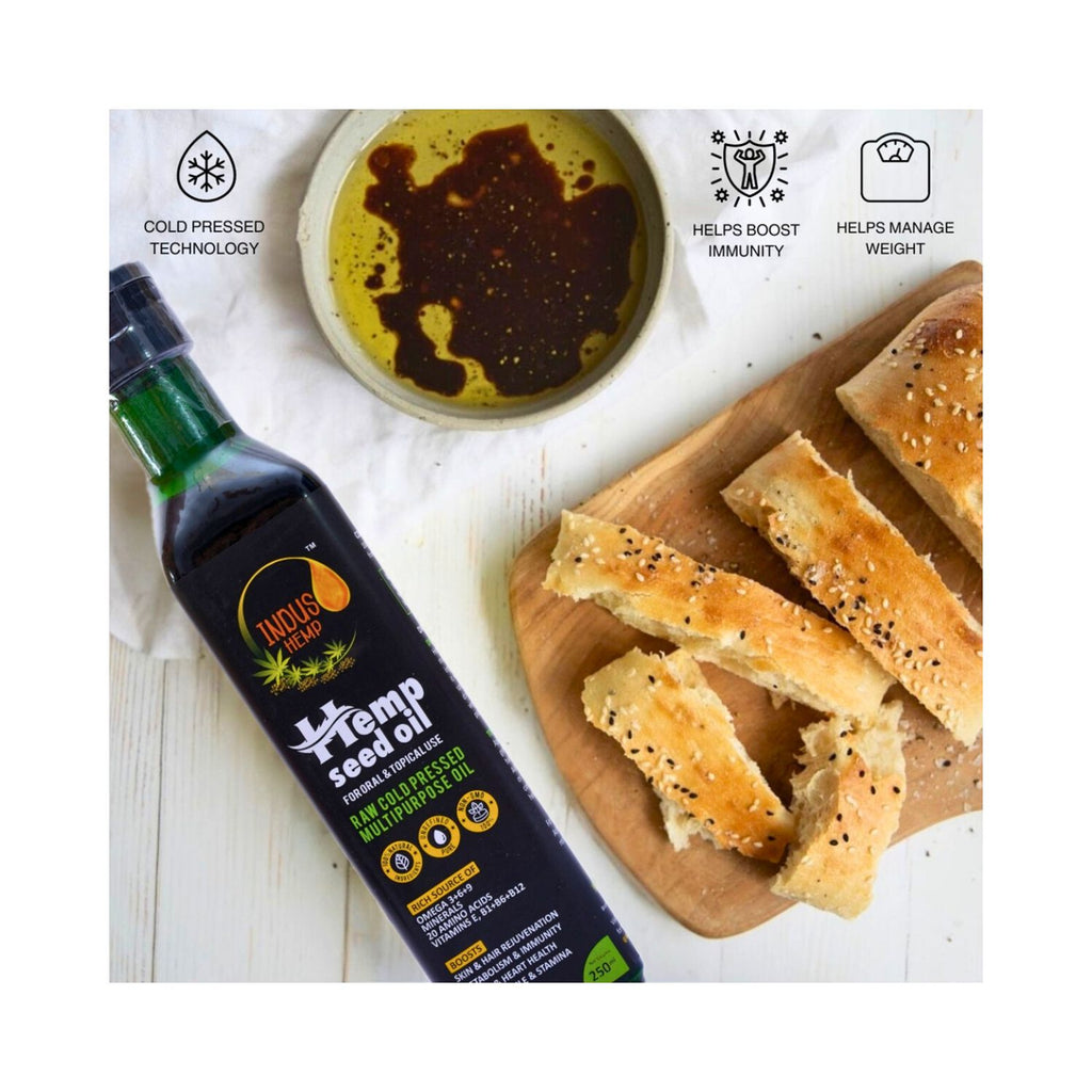 Hemp seed oil bottle with bread slices on a wooden board