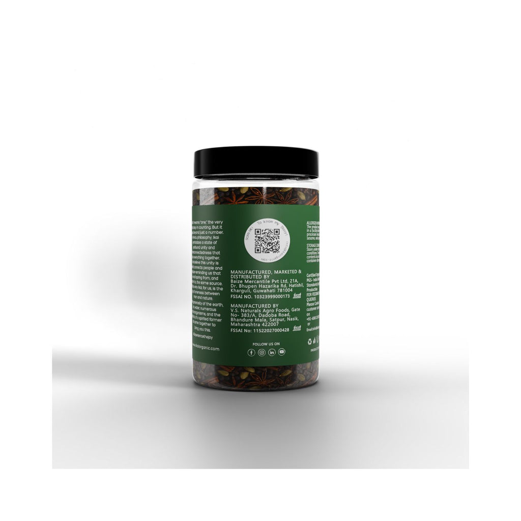 Jar of IKAI Natural Whole Garam Masala with a green label on a white background showing manufacturing info