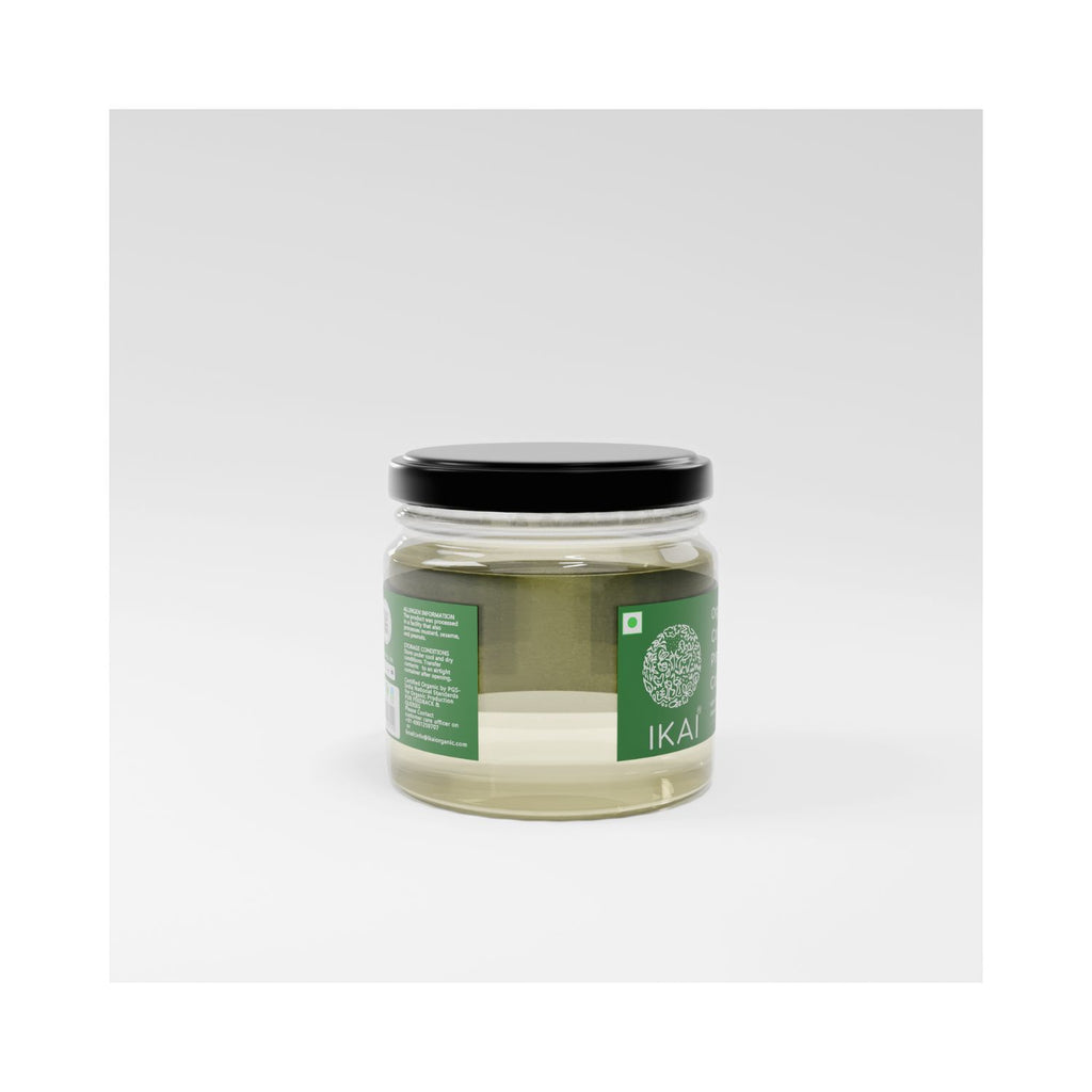 Jar of organic cold pressed coconut oil on a white background different angle