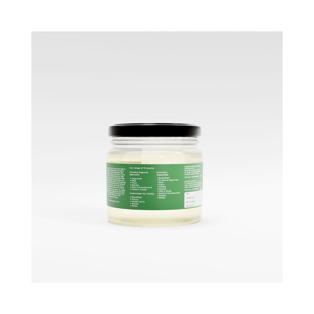 Jar of organic cold pressed coconut oil with a green label on a white background showing text of curated product range