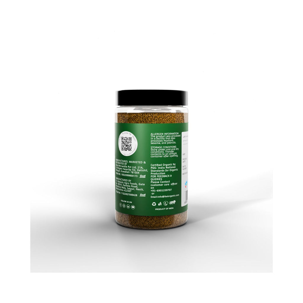 Jar of ikai cumin seeds with a green label on a white background