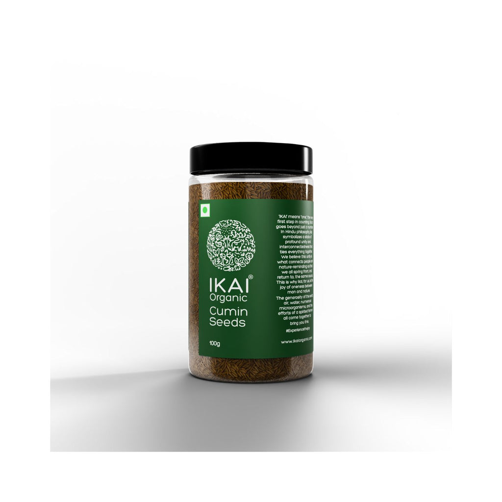 Jar of IKAI organic cumin seeds on a white and grey background