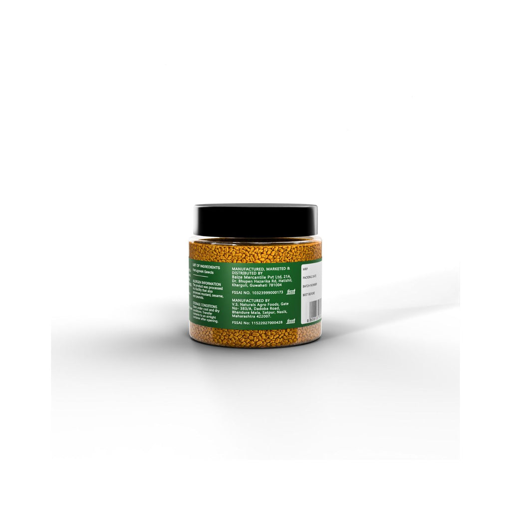 Jar of IKAI organic fenugreek seeds with manufacturing info on a green label on a white background