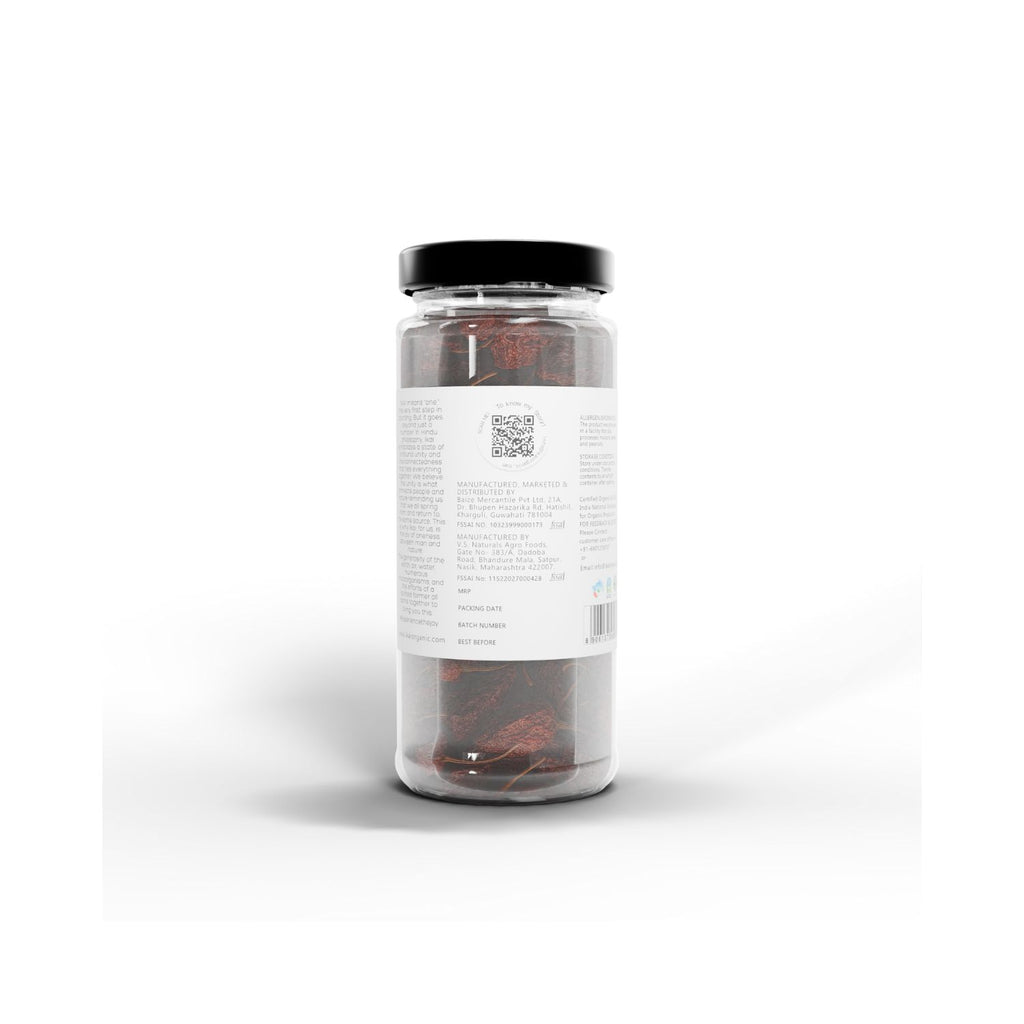 Jar of IKAI natural bhut jolokia with a label on a white background showing barcode and manufacturer info