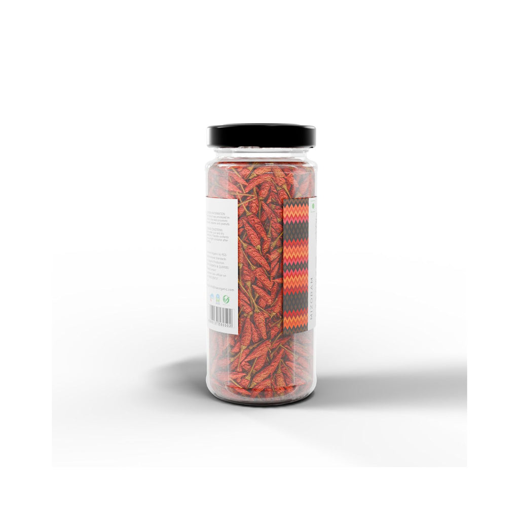 Jar of IKAI natural bird's eye chili peppers on a white background from a different angle