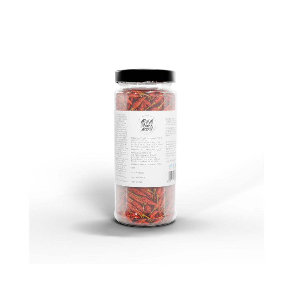 Jar of IKAI natural bird's eye chilli peppers with a label on a white background showing the barcode and manufacturer info