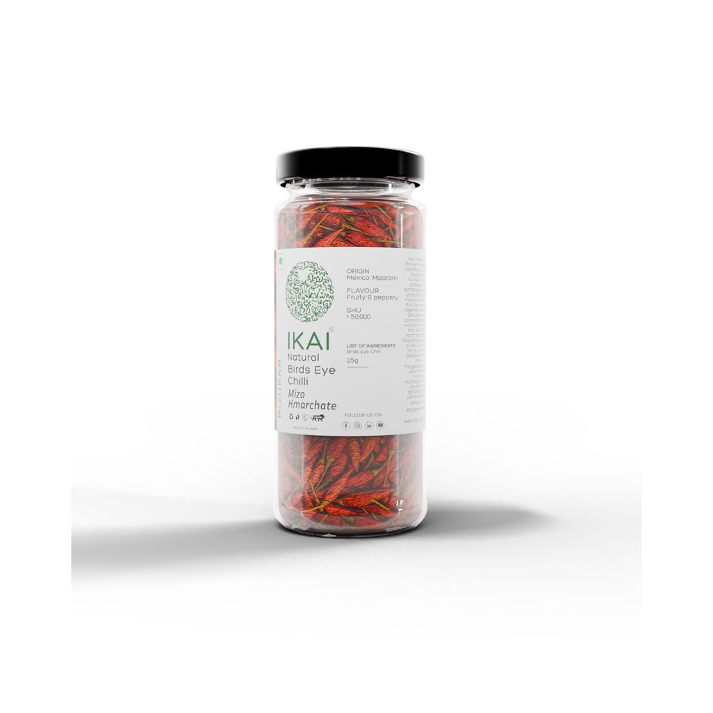 Jar of IKAI natural bird's eye chilli peppers label on a white background showing product sourcing info