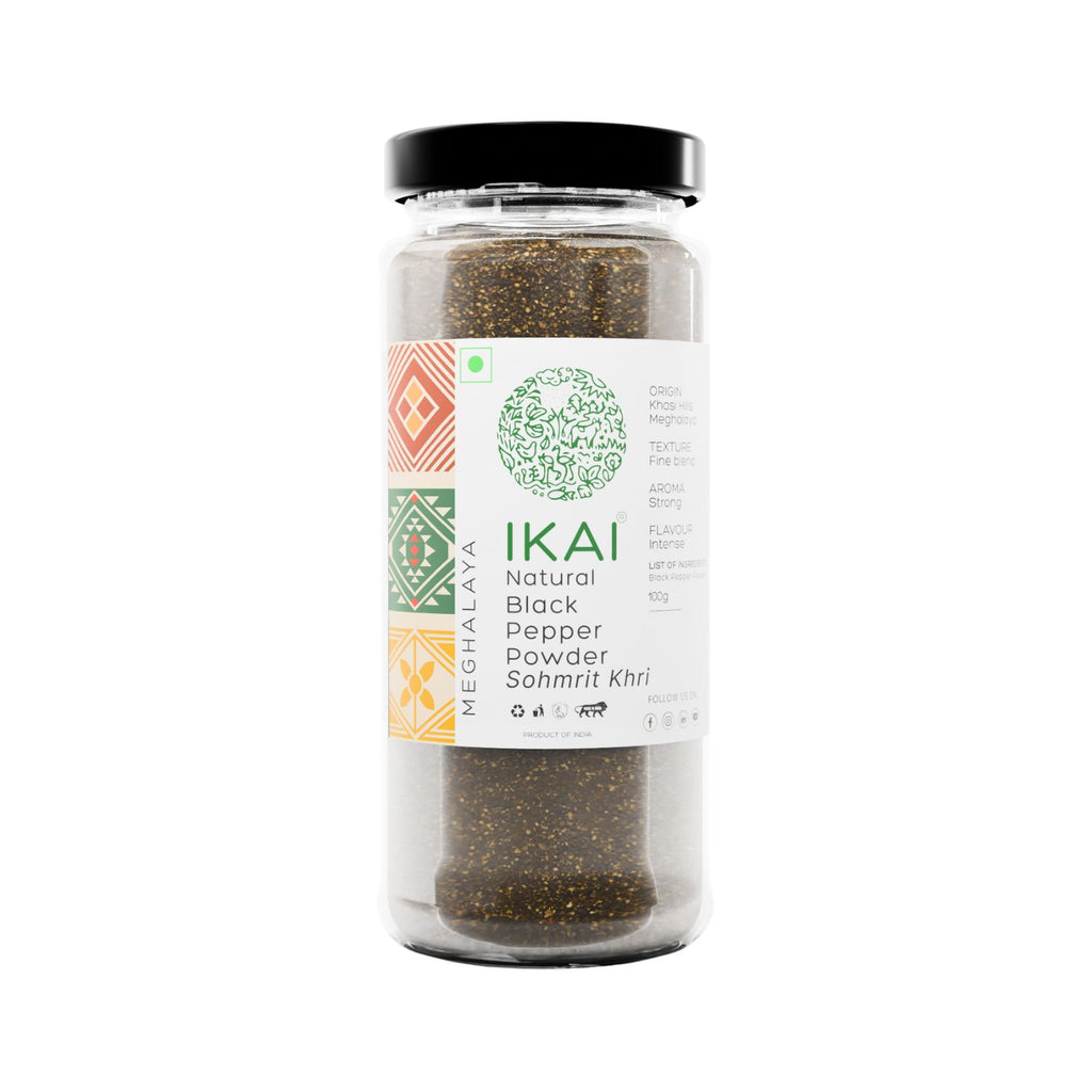 Jar of IKAI natural black pepper powder on a white background