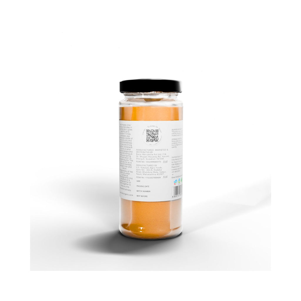 Jar of IKAI Natural Lakadong Turmeric Latte with a black lid on a white background with text about manufacturing info