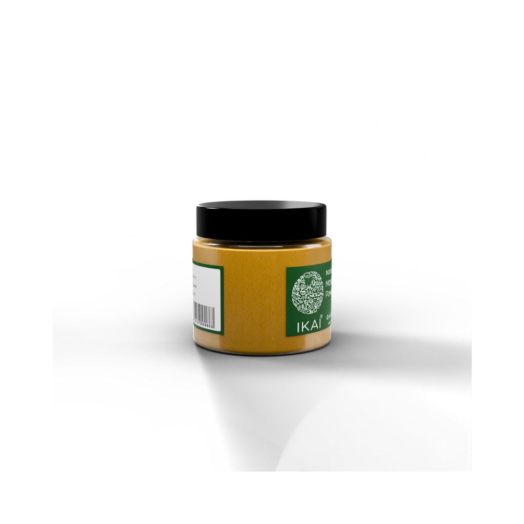 Jar of IKAI natural mango powder with a green and white label on a white background