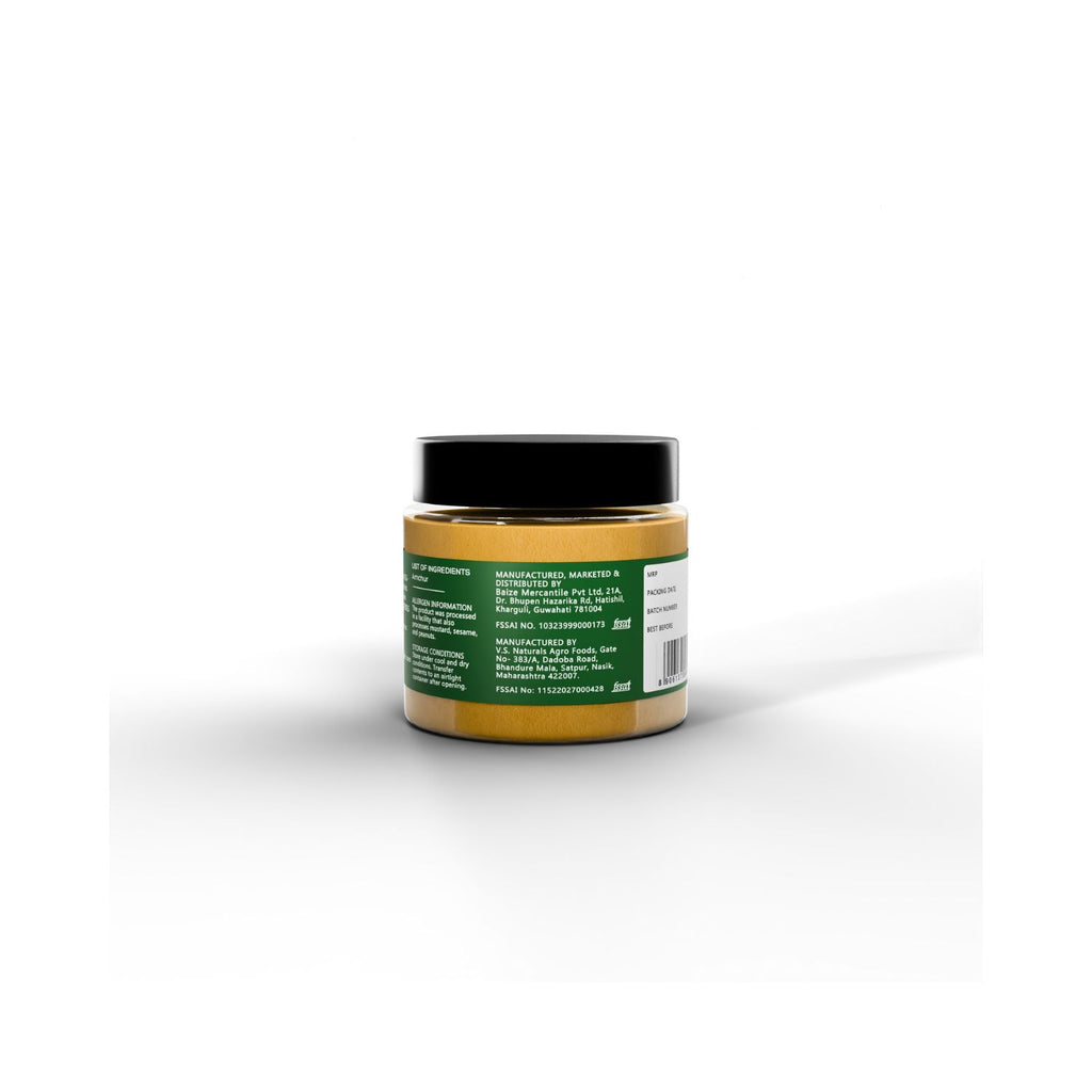 Jar of IKAI natural mango powder with manufacturer info on a green label on a white background