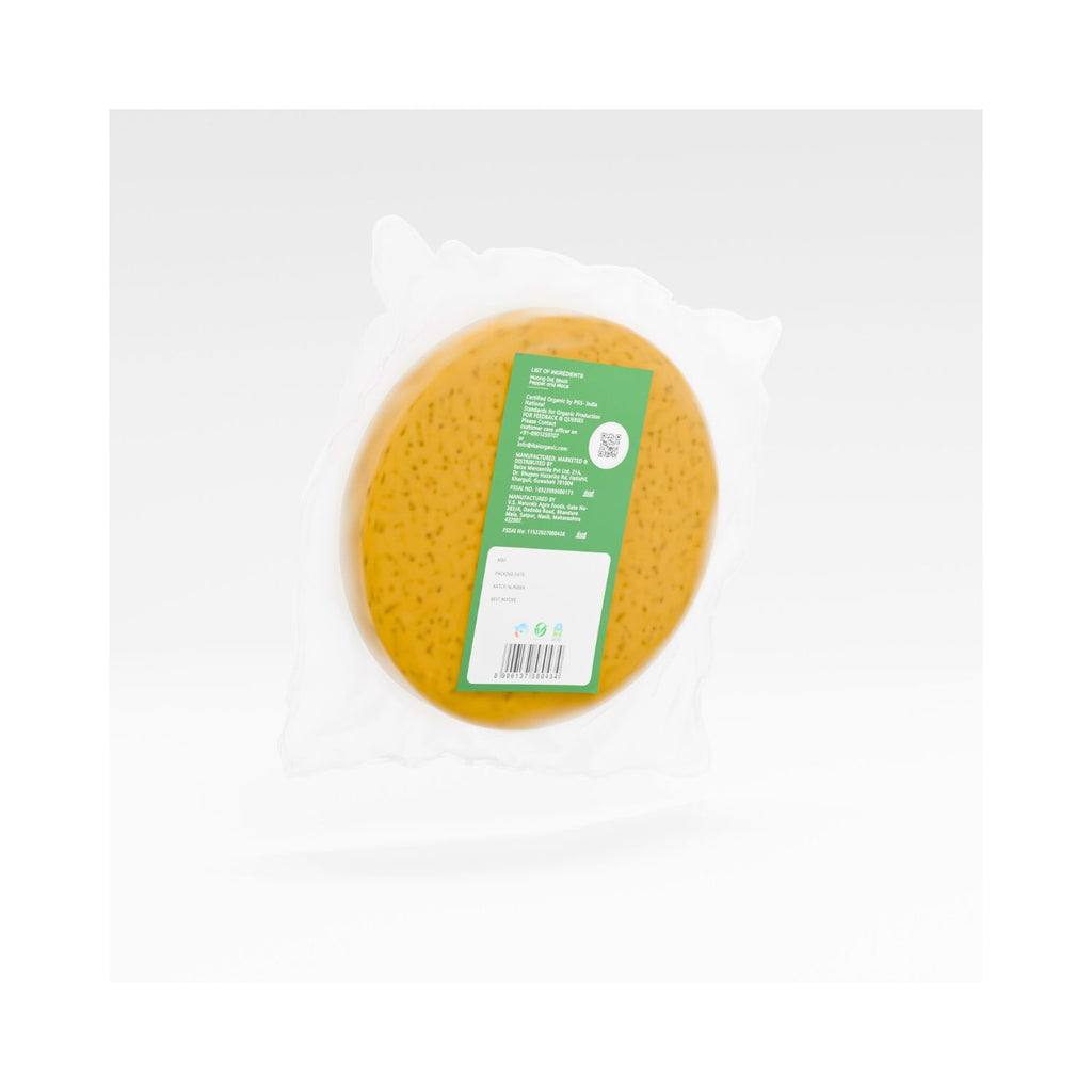 Pack of Yellow round papad with a green label on a white background showing manufacturing info