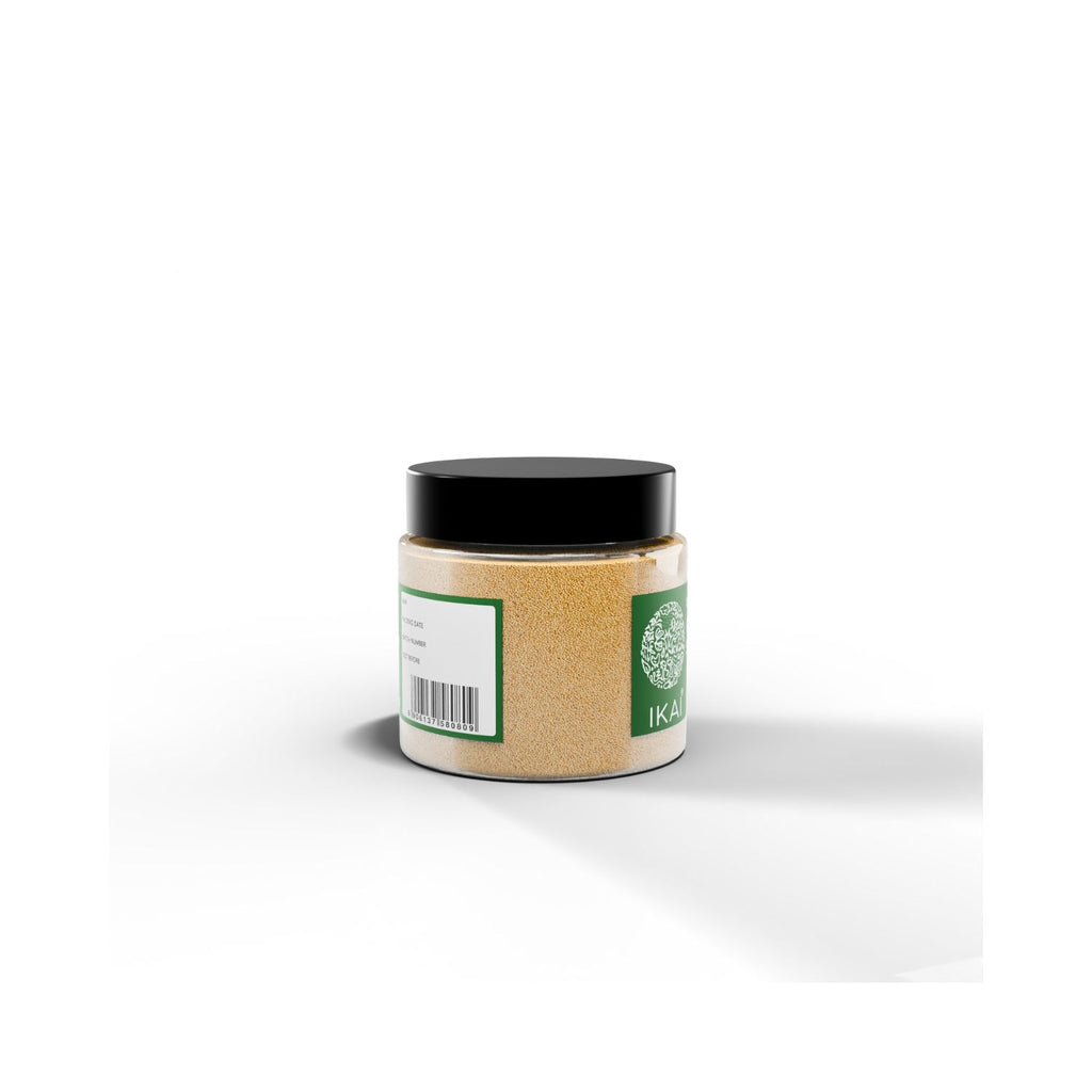Jar of natural poppy seeds with IKAI branding with barcode on a green label on a white background