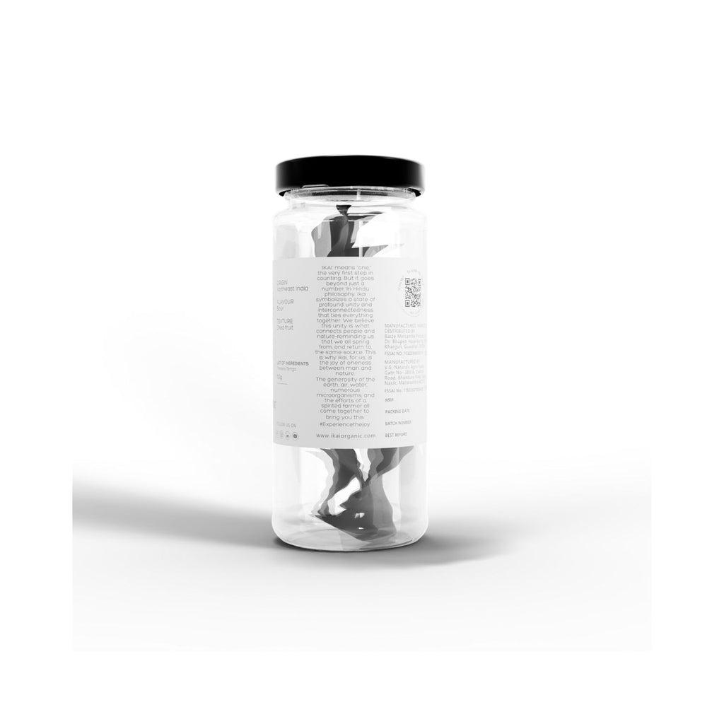 Jar of IKAI natural thekera tenga fruit spice with black lid on a white background with text about what IKAI means