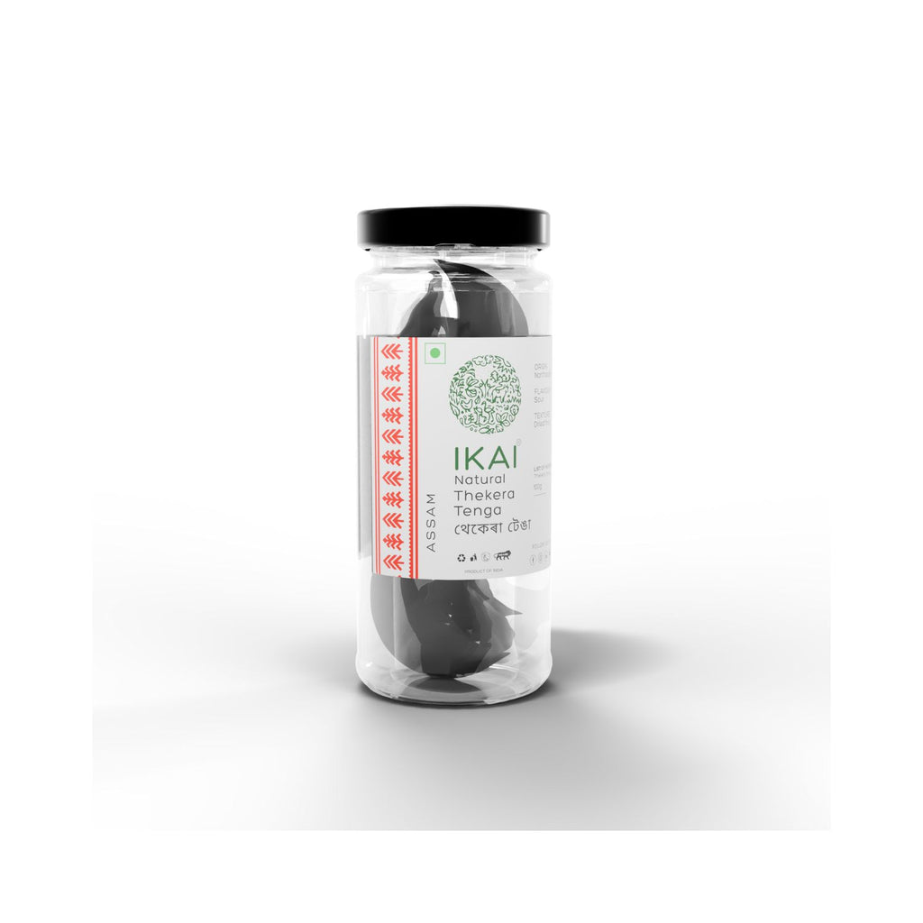 Jar of IKAI natural thekera tenga fruit spice on a white background different angle