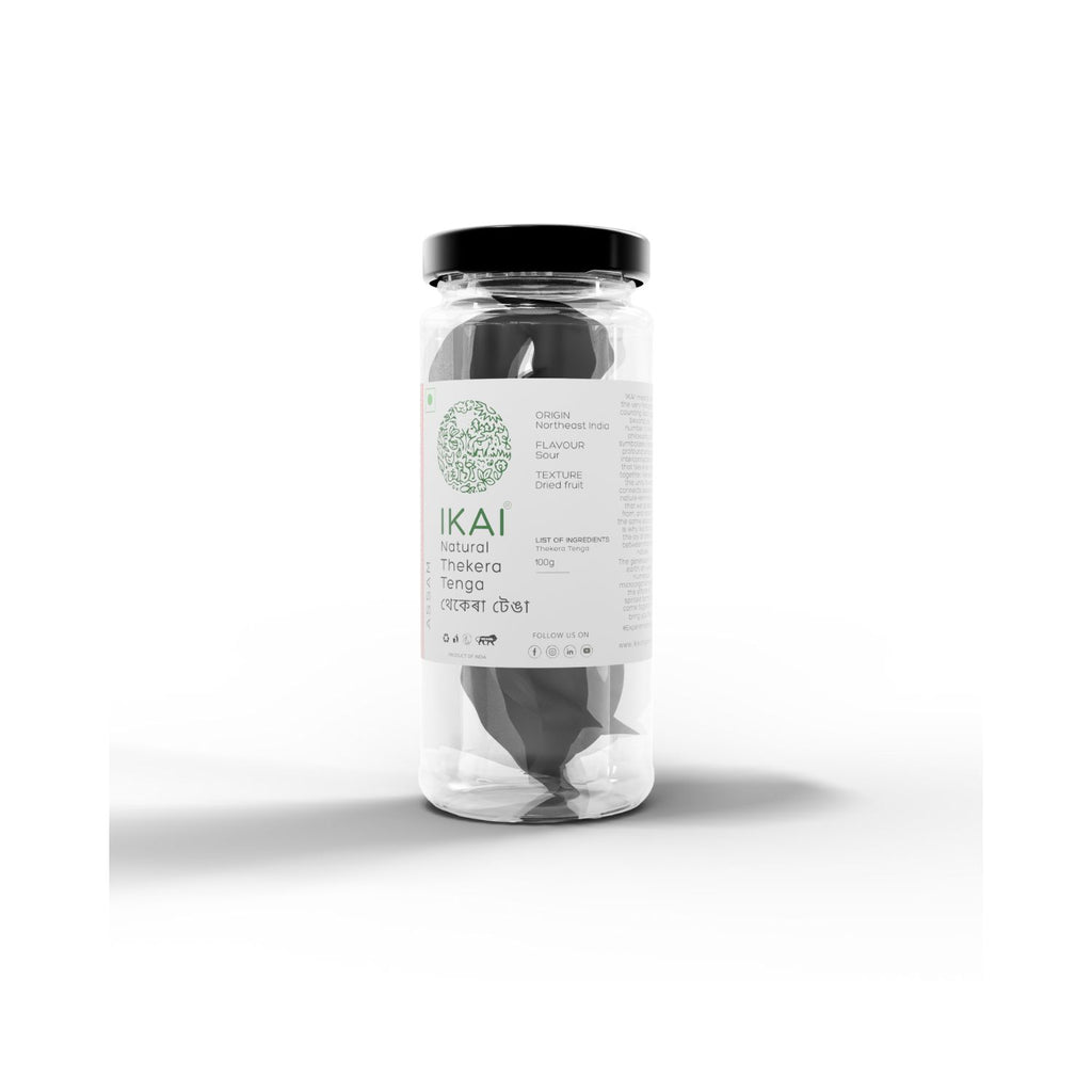 Jar of IKAI natural thekera tenga fruit spice on a white background with text showing product origins