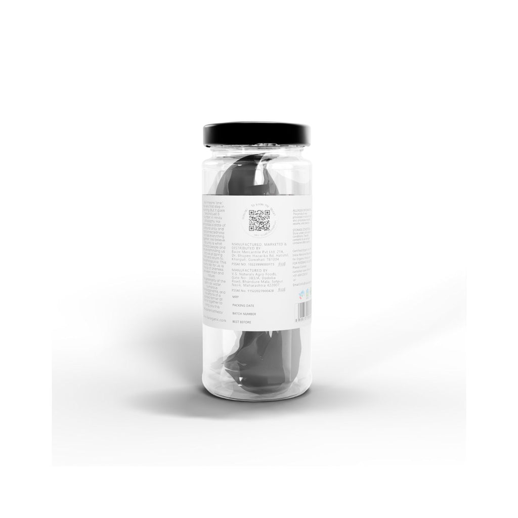 Jar of IKAI natural thekera tenga fruit spice with black lid on a white background showing QR code and manufacturer info