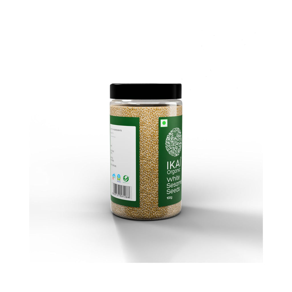 Jar of white sesame seeds with a green label on a white background with barcode from a different angle