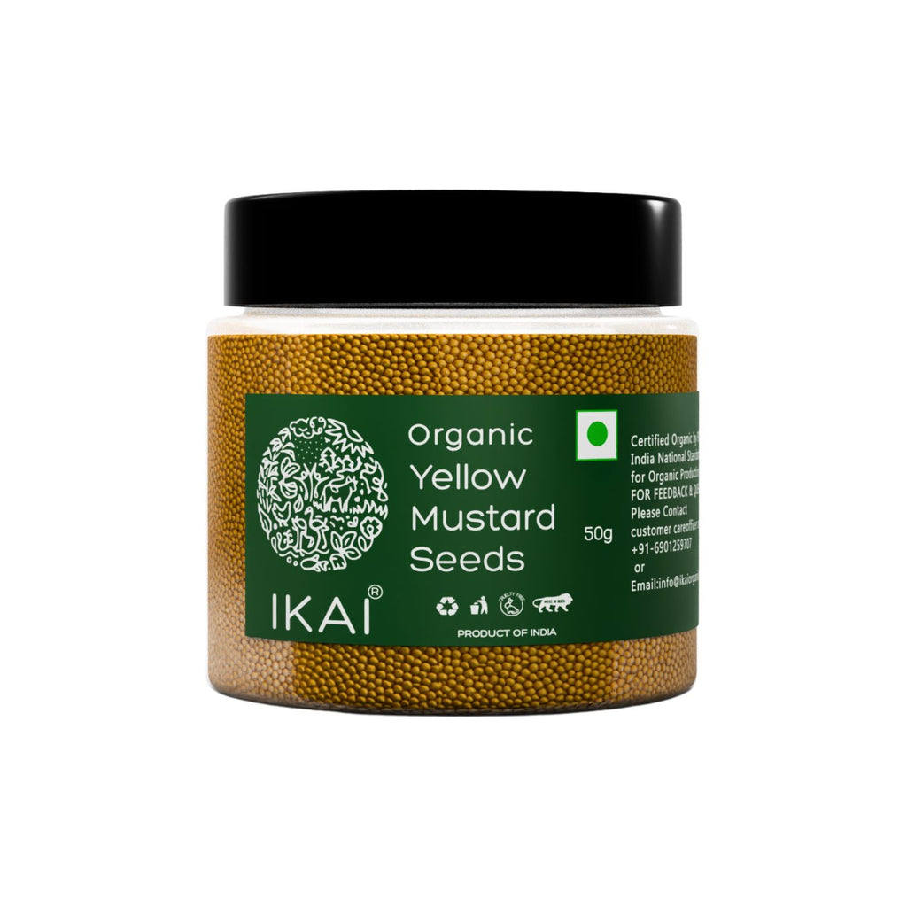Jar of organic yellow mustard seeds with IKAI branding on a white background