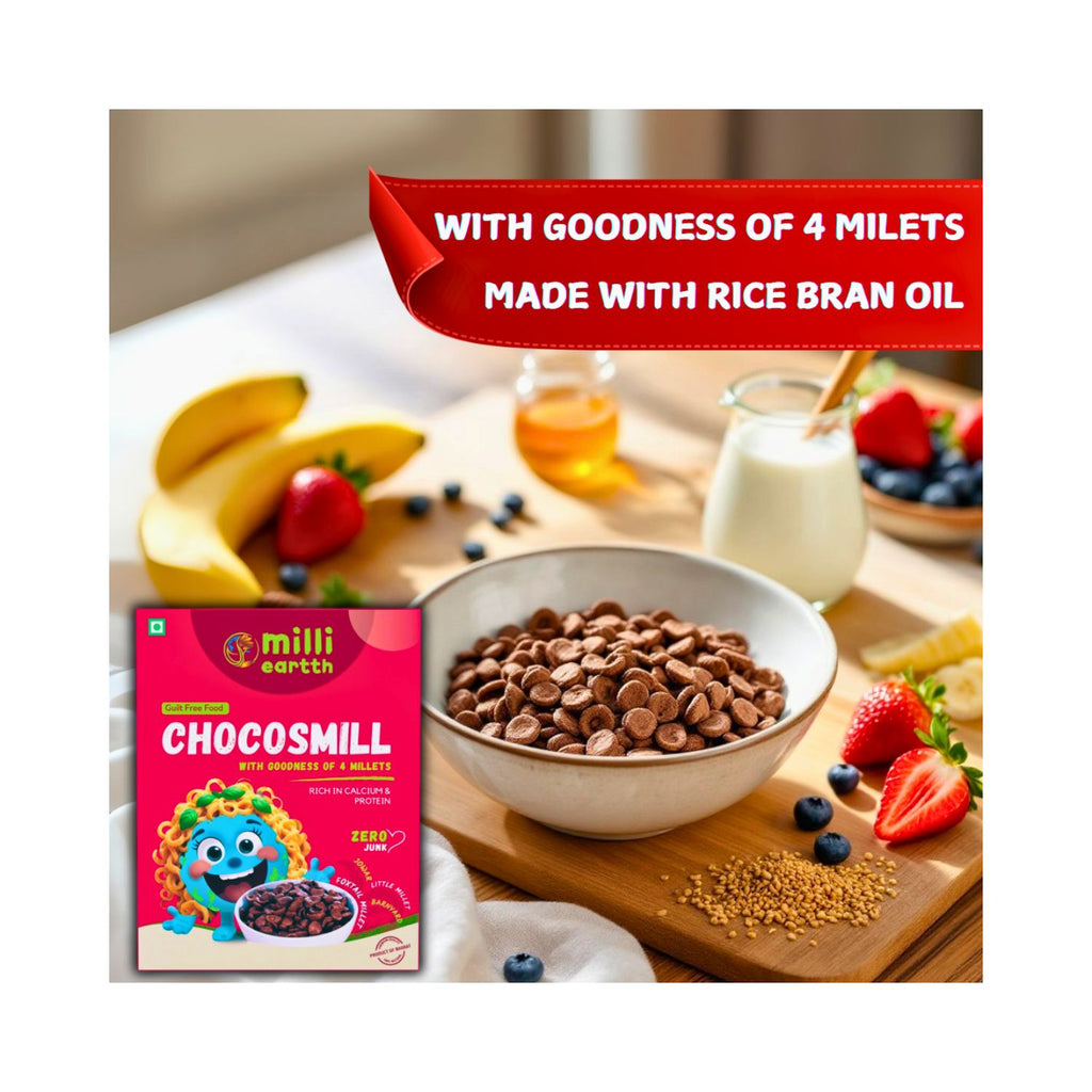 Chocosmill packaging with a bowl of chocolate chips on a table with fruits and a jar of milk.