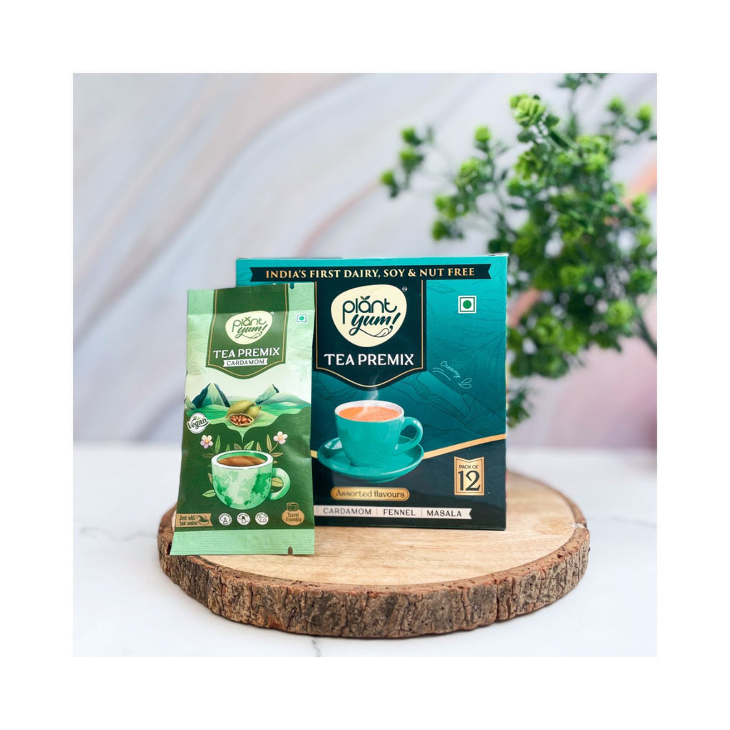 plant_yum_instant_tea_premix_cardamom_elaichi_vegan_pack_of_12_18g_216g_pack_front_lifestyle_1