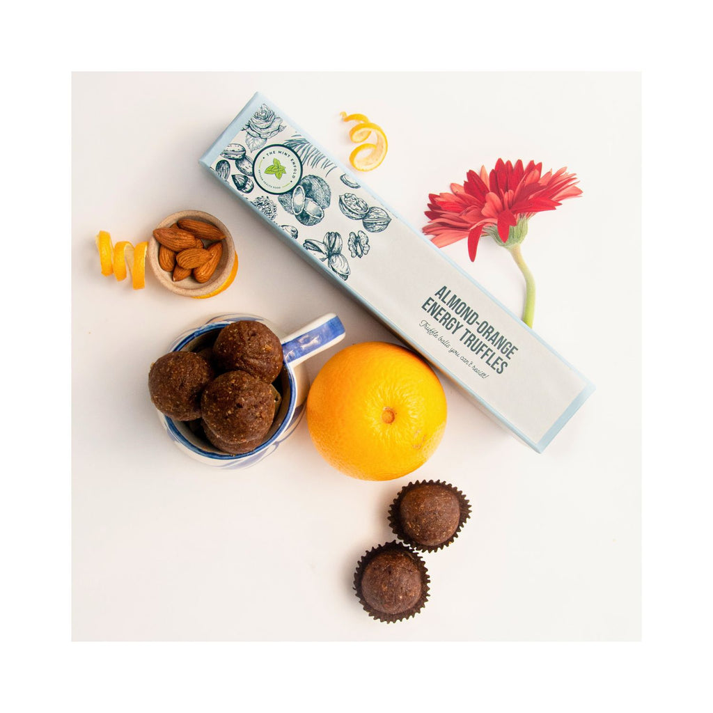 the_mint_enfold_almond_orange_energy_truffles_150g_box_of_6_pack_lifestyle