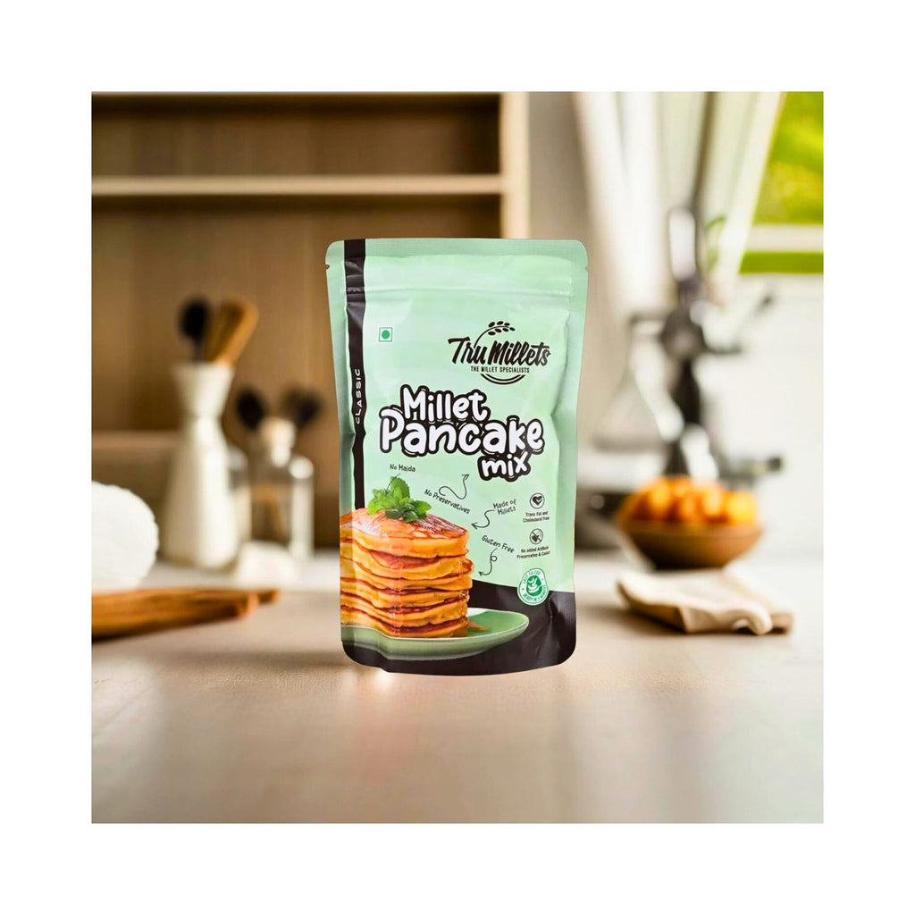 tru_millets_millet_classic_pancake_mix_pack_of_3_450g_pack_front_on_kitchen_table